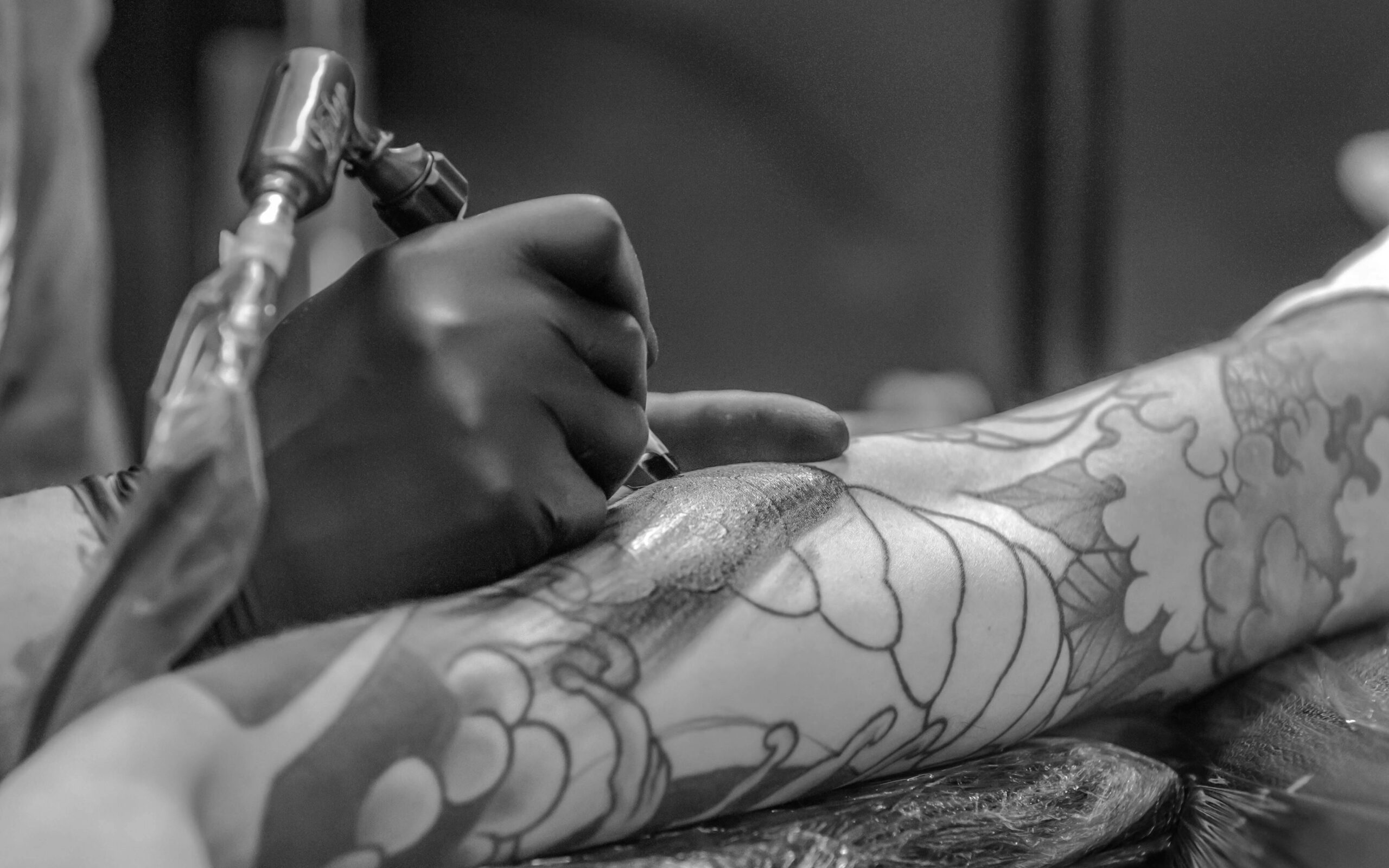 Tatto artist, piercing parlor, black and white